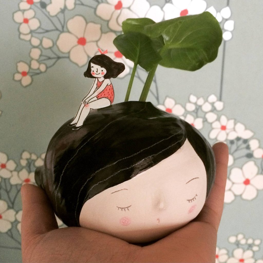 seforapons-doodles-ceramic-sculpture-vase-sittingonthehead
